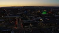 5.7K stock footage aerial video DoubleTree hotel with blue lighting near office buildings at twilight, Downtown Albuquerque, New Mexico Aerial Stock Footage | DX0002_123_028