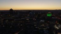 5.7K stock footage aerial video flyby and approach DoubleTree hotel with blue lighting near office buildings at twilight, Downtown Albuquerque, New Mexico Aerial Stock Footage | DX0002_123_031