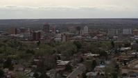 5.7K stock footage aerial video of ascending from residential street to focus on Downtown Albuquerque, New Mexico Aerial Stock Footage | DX0002_126_035