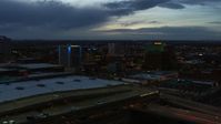 5.7K stock footage aerial video fly over convention center to approach hotel and office buildings at twilight, Downtown Albuquerque, New Mexico Aerial Stock Footage | DX0002_128_022