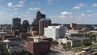5.7K stock footage aerial video the city's skyline seen while ascending past office buildings in Downtown Des Moines, Iowa Aerial Stock Footage | DX0002_165_005