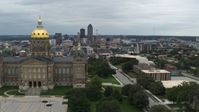 5.7K stock footage aerial video of flying away from the distant skyline and reveal the capitol building, Des Moines, Iowa Aerial Stock Footage | DX0002_166_038