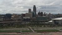 5.7K stock footage aerial video of a view of the city skyline from riverfront park, Downtown Omaha, Nebraska Aerial Stock Footage | DX0002_168_018