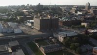 5.7K stock footage aerial video of approaching a brick office building at sunset, Downtown Omaha, Nebraska Aerial Stock Footage | DX0002_170_046