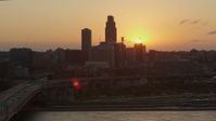 5.7K stock footage aerial video slowly circle the skyline, setting sun in background, Downtown Omaha, Nebraska Aerial Stock Footage | DX0002_172_032