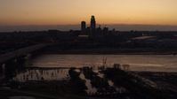 5.7K stock footage aerial video of the skyline seen from bridge over the river at twilight, Downtown Omaha, Nebraska Aerial Stock Footage | DX0002_172_042