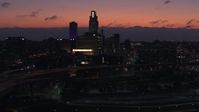 5.7K stock footage aerial video reverse view of skyscrapers in the skyline at twilight, Downtown Omaha, Nebraska Aerial Stock Footage | DX0002_173_002