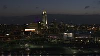 5.7K stock footage aerial video of passing by the city's skyline at twilight, Downtown Omaha, Nebraska Aerial Stock Footage | DX0002_173_015