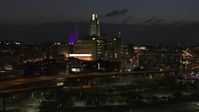 5.7K stock footage aerial video fly away from the city's skyline at twilight, seen from river, Downtown Omaha, Nebraska Aerial Stock Footage | DX0002_173_019