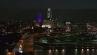 5.7K stock footage aerial video follow bridge to approach the city's skyline at night, Downtown Omaha, Nebraska Aerial Stock Footage | DX0002_173_035