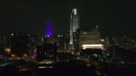 5.7K stock footage aerial video of towering skyscrapers and high-rises at night, Downtown Omaha, Nebraska Aerial Stock Footage | DX0002_173_056