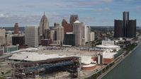 5.7K stock footage aerial video of flying by the arena and convention center to approach skyline, Downtown Detroit, Michigan Aerial Stock Footage | DX0002_189_005