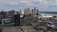 5.7K stock footage aerial video of the skyline behind office buildings, Downtown Detroit, Michigan Aerial Stock Footage | DX0002_189_030