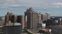 5.7K stock footage aerial video flyby and away from federal building and skyscrapers, Downtown Detroit, Michigan Aerial Stock Footage | DX0002_189_043