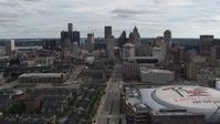 5.7K stock footage aerial video flying by the city's downtown skyline and arena, Downtown Detroit, Michigan Aerial Stock Footage | DX0002_191_003