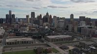 5.7K stock footage aerial video the skyline behind Comerica Park stadium, Downtown Detroit, Michigan Aerial Stock Footage | DX0002_191_011