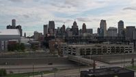 5.7K stock footage aerial video descend low while focused on baseball stadium and skyline, Downtown Detroit, Michigan Aerial Stock Footage | DX0002_191_019