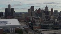 5.7K stock footage aerial video approach stadiums, ascend with view of the skyline in Downtown Detroit, Michigan Aerial Stock Footage | DX0002_191_034