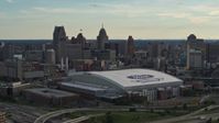 5.7K stock footage aerial video of Ford Field football stadium and the city skyline at sunset in Downtown Detroit, Michigan Aerial Stock Footage | DX0002_191_046