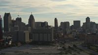 5.7K stock footage aerial video flyby the city skyline at sunset, descend with view of courthouse, Downtown Detroit, Michigan Aerial Stock Footage | DX0002_192_005