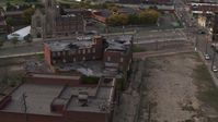 5.7K stock footage aerial video orbit around an abandoned building at sunset, Detroit, Michigan Aerial Stock Footage | DX0002_192_016