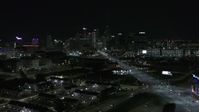 5.7K stock footage aerial video flying near Grand River Avenue while focused on skyline at nighttime, Downtown Detroit, Michigan Aerial Stock Footage | DX0002_193_025