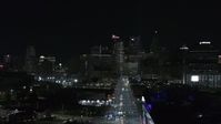 5.7K stock footage aerial video of the skyline at night during descent over Grand River Avenue, Downtown Detroit, Michigan Aerial Stock Footage | DX0002_193_032