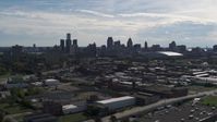 5.7K stock footage aerial video wide view of the city's skyline seen from brick industrial buildings, Downtown Detroit, Michigan Aerial Stock Footage | DX0002_195_017