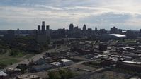 5.7K stock footage aerial video a reverse view of the city's skyline from brick industrial buildings, Downtown Detroit, Michigan Aerial Stock Footage | DX0002_195_020