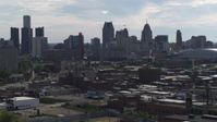 5.7K stock footage aerial video focus on the city's skyline while flying past brick buildings, Downtown Detroit, Michigan Aerial Stock Footage | DX0002_195_027