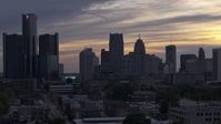 5.7K stock footage aerial video of flying by the city's skyline at sunset, Downtown Detroit, Michigan Aerial Stock Footage | DX0002_197_026