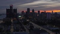 5.7K stock footage aerial video of ascending past the city's towering skyscrapers at twilight, Downtown Detroit, Michigan Aerial Stock Footage | DX0002_198_010