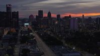 5.7K stock footage aerial video of slowly flying away from the city's towering skyscrapers at twilight, Downtown Detroit, Michigan Aerial Stock Footage | DX0002_198_012