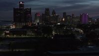 5.7K stock footage aerial video of the city's skyline, seen during descent at twilight in Downtown Detroit, Michigan Aerial Stock Footage | DX0002_198_031