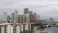 5.7K stock footage aerial video fly away from tall skyscrapers, descend by apartments in Downtown Tampa, Florida Aerial Stock Footage | DX0003_229_004