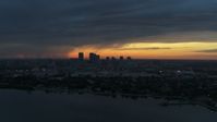 5.7K stock footage aerial video of the distant city skyline of Downtown Tampa, Florida at sunset Aerial Stock Footage | DX0003_231_042