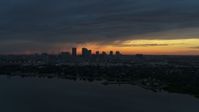5.7K stock footage aerial video of the distant city skyline of Downtown Tampa, Florida at sunset Aerial Stock Footage | DX0003_231_044