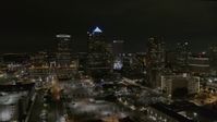 5.7K stock footage aerial video orbit and fly away from skyscrapers at night in Downtown Tampa, Florida Aerial Stock Footage | DX0003_232_027