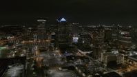 5.7K stock footage aerial video of slowly flying away from skyscrapers at nighttime in Downtown Tampa, Florida Aerial Stock Footage | DX0003_232_035