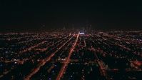 HD stock footage aerial video fly over the West Side to approach Downtown Chicago, Illinois skyline at night Aerial Stock Footage | ED0001_000004