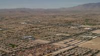 4K stock footage aerial video fly over neighborhoods with tract homes and approach an elementary school in Las Vegas, Nevada Aerial Stock Footage | FG0001_000356