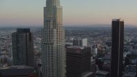 HD stock footage aerial video flyby top of Bank of America Center, focus on US Bank Tower at twilight, Downtown Los Angeles, California Aerial Stock Footage | HDA06_57