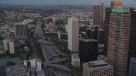 HD stock footage aerial video tilt to light traffic on the 110 freeway by skyscrapers in Downtown Los Angeles, California, twilight Aerial Stock Footage | HDA06_68