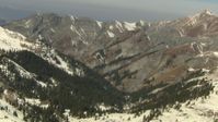 HD stock footage aerial video approach mountain ridge and pan to snowy slopes in the Rocky Mountains, Colorado Aerial Stock Footage | HDA13_366