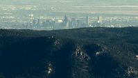 HD stock footage aerial video of the Downtown Denver skyline seen from a ridge in the Rocky Mountains, Colorado Aerial Stock Footage | HDA13_477_01