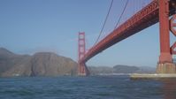 5K stock footage aerial video of flying low over the Bay, under the Golden Gate Bridge, San Francisco, California Aerial Stock Footage | JDC02_033