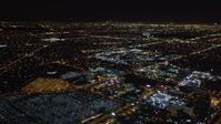 5K stock footage aerial video track a passenger jet landing at night, LAX (Los Angeles International Airport), California Aerial Stock Footage | LD01_0016
