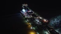 5K stock footage aerial video of flying around the Santa Monica Pier, California at night Aerial Stock Footage | LD01_0031