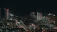 HD stock footage aerial video approach Trump Taj Mahal Hotel and Casino at night in Atlantic City, New Jersey Aerial Stock Footage | PP003_029