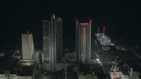 HD stock footage aerial video of panning across hotels and casinos at night in Atlantic City, New Jersey Aerial Stock Footage | PP003_030